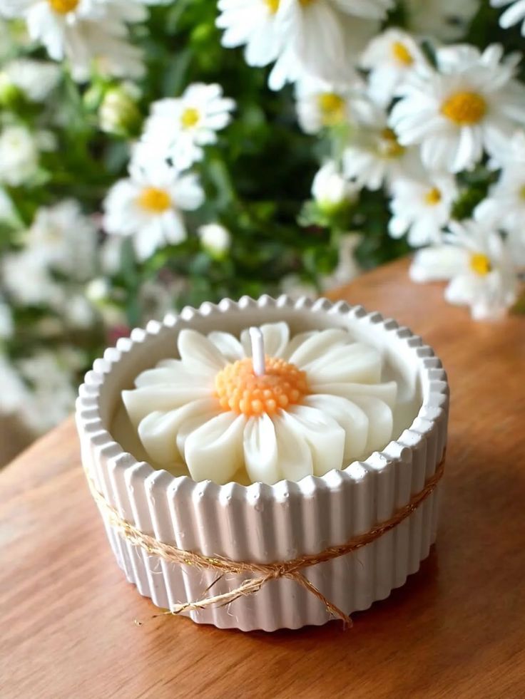 Daisy flower candle in a fluted holder