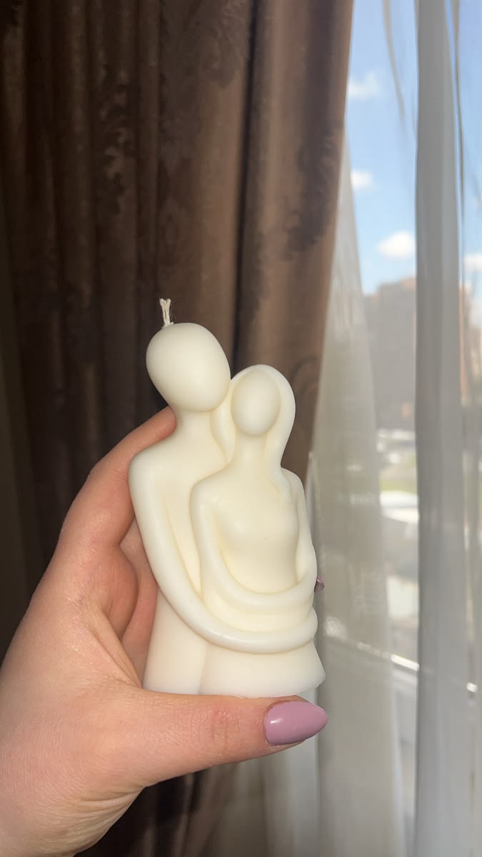 Cream bear-shaped candle beside an ivory speckled fluted candle vessel, photo 5
